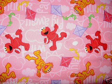 Sesame Street Zoe and Elmo flying kites pink Flannel Fabric 