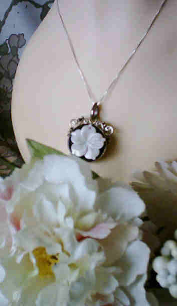 Mother of Pearl Sterling Silver Onyx Flower Pendant from classiquetreasures.org