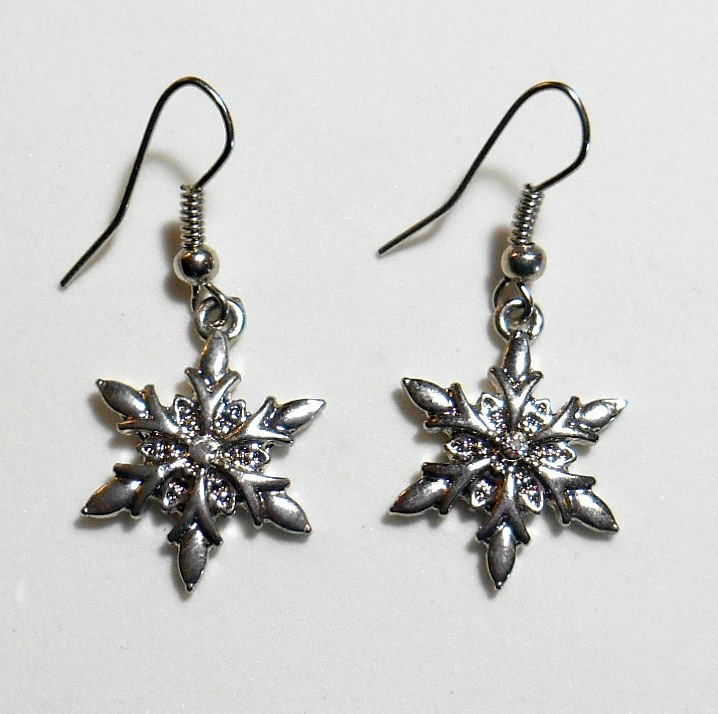 Silver snowflake rhinestone necklace with matching silver snowflake earrings.