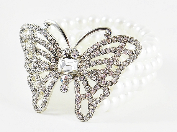 Rhinestone and silver butterfly on 4 line pearl stretch bracelet