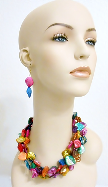 Three strands of vibrant rainbow multi color shells make up this unique necklace. The matching hook dangle earrings are made of the same pink and blue shells.