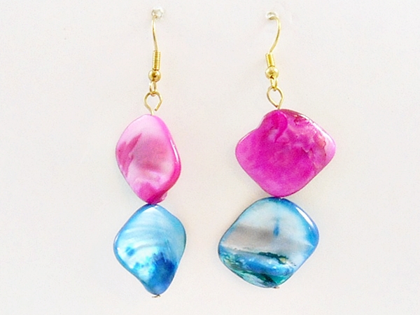 Three strands of vibrant rainbow multi color shells make up this unique necklace. The matching hook dangle earrings are made of the same pink and blue shells.