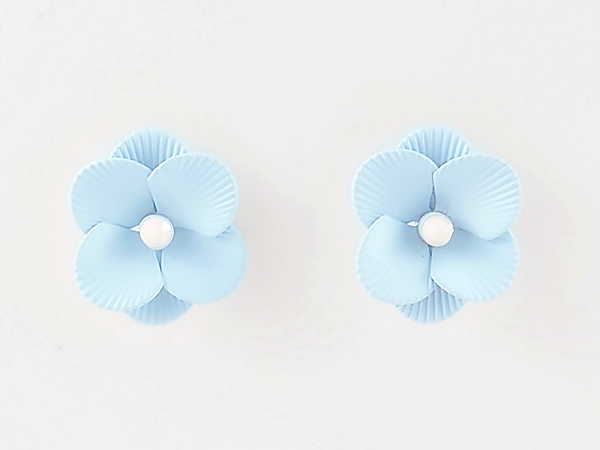 Feminine and detailed sky blue epoxy metal flower post earrings with tiny white center.