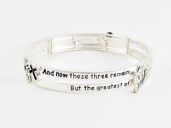 Bible verse Christian silver stretch bracelet with 1 Corinthians 13:13 features black lettering and accents including a heart, anchor and cross along with heart cutouts.