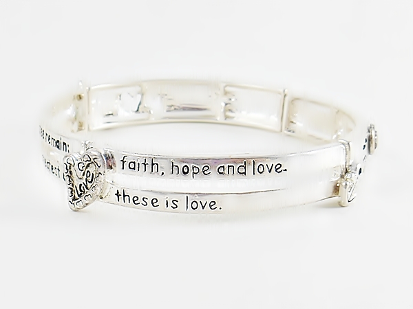Bible verse Christian silver stretch bracelet with 1 Corinthians 13:13 features black lettering and accents including a heart, anchor and cross along with heart cutouts.