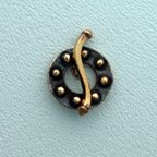 Thumbnail of SakiBrTog73 - Saki bronze round nailhead toggle w/squiggle bar - Thailand