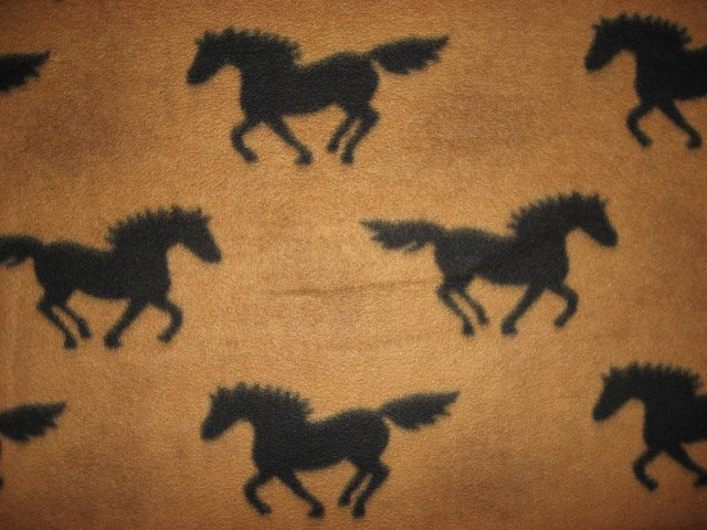 Black horses running on brown fleece by the yard to make a blanket or sew 