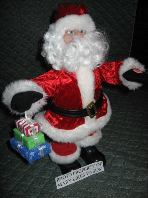 Christmas Santa doll from Dillards sings and walks forward and backward to music