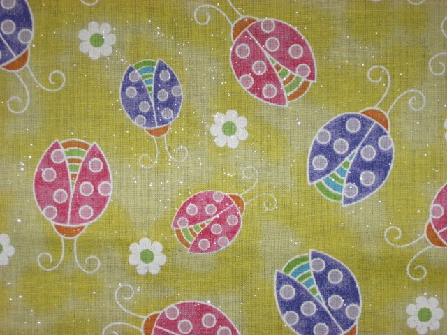 Image 1 of Multicolored Ladybugs on Yellow Glittered cotton Fabric by the yard