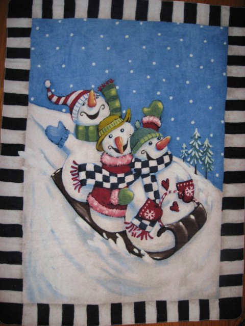 Snowmen on a toboggan fleece blanket