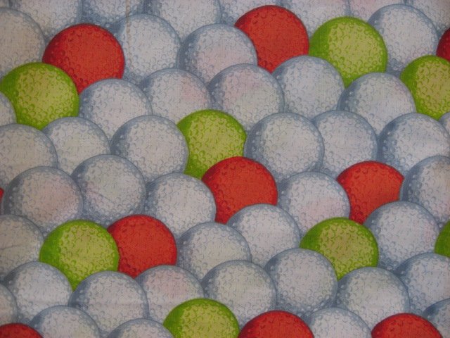 Image 0 of Daisy Kingdom Neon green, orange and white golf balls on 100% cotton fabric 