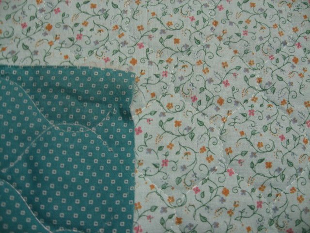 Flowers and vines on double faced light green Quilted floral Fabric to Sew