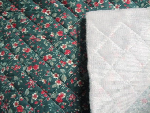 Image 0 of Flowers on single faced dark green Quilted floral Fabric to Sew