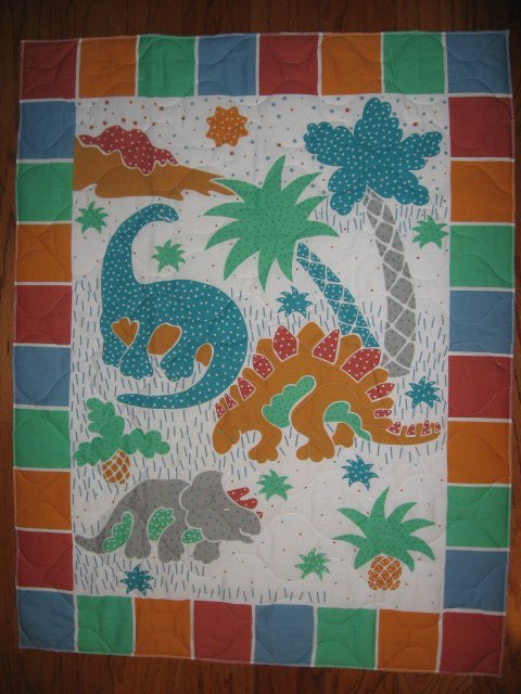 Image 0 of Whimsical dinosaurs crib quilt fabric panel finished edges