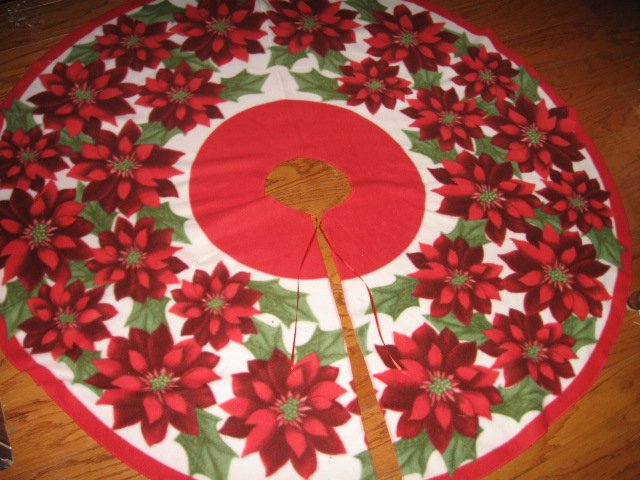 Image 0 of Poinsettia Fleece Christmas tree skirt finished surged edge satin tie