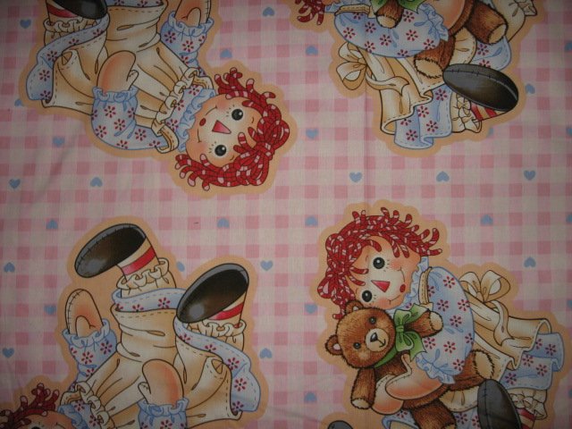 make two Raggeddy Ann fabric dolls 