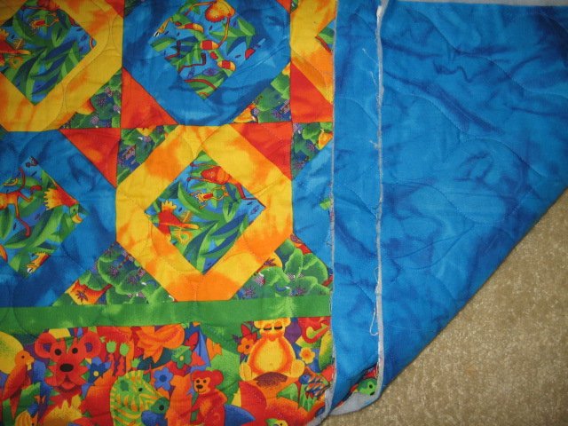 Image 1 of Jungle collage  baby animals matching border quilt 42 X 35 inch