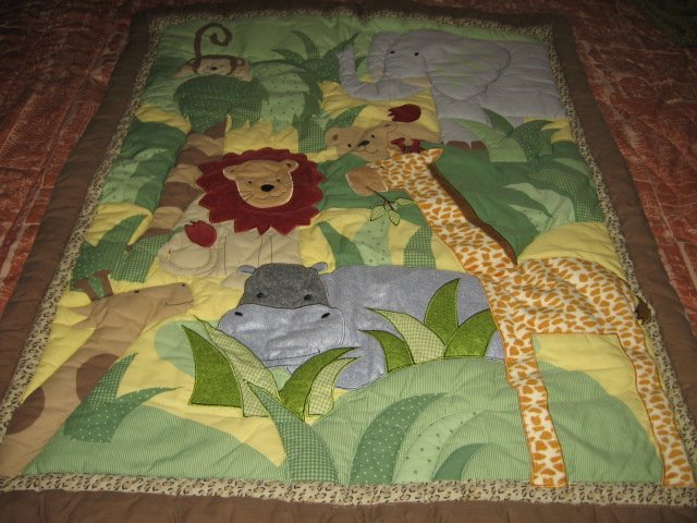 Image 0 of Giraffe Monkey Lion Elephant Hippo crib quilt with backing fabric