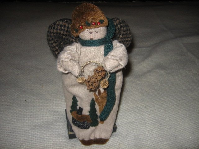 Image 0 of Christmas Angel stand  11 inch wings cabin trees collectible