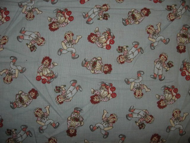 Raggedy Ann and Andy wagon flowers tiny pictures cotton fabric by the yard