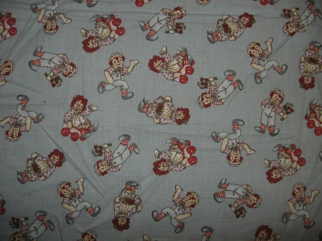 Image 0 of Raggedy Ann and Andy wagon flowers tiny pictures cotton fabric by the yard