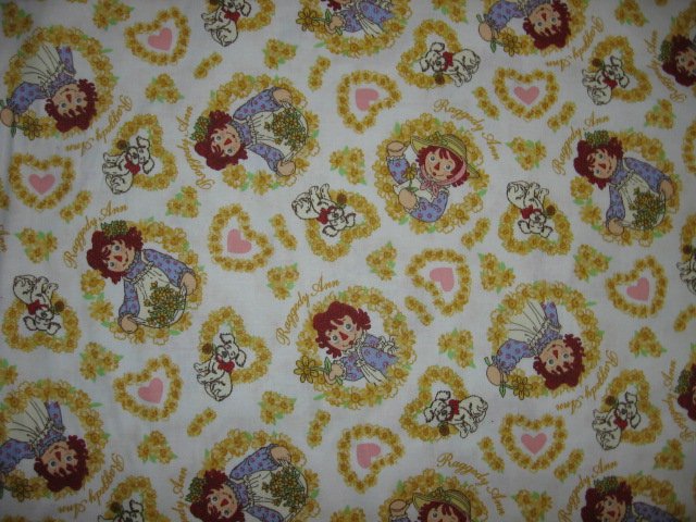 Raggedy Ann hearts flowers yellow   cotton fabric by the yard