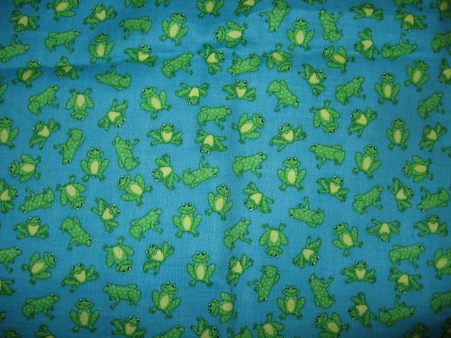 frog with spots on medium blue background cotton fabric by the yard
