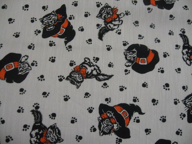 Halloween Cats in witch hats and paw prints White Cotton fabric by the yard