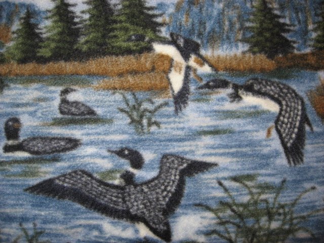 Image 1 of Loons flying over lake and islands fleece fabric blanket