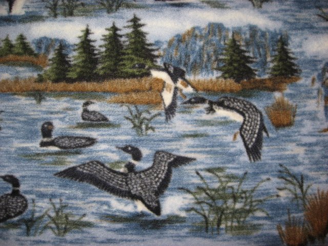Loons flying over lake and islands fleece fabric blanket