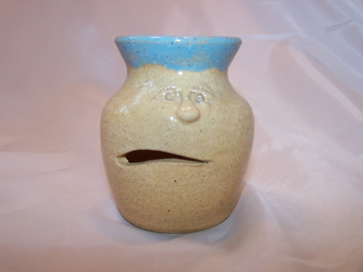 Image 0 of With a Grin and a Slurp, Clay Man Egg Separator Helps Cook