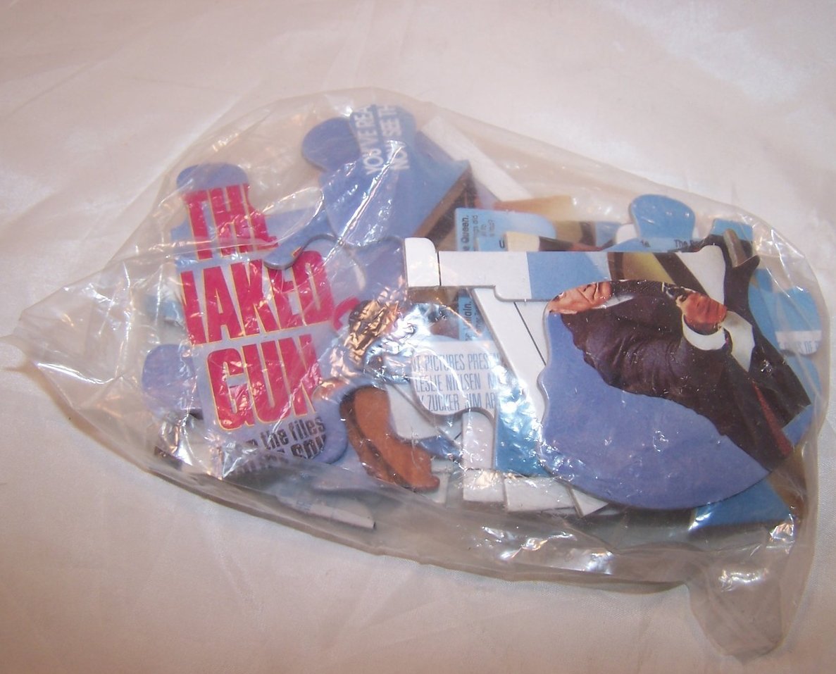 Image 2 of The Naked Gun Promotional Puzzle, Original Can, Bag Unopened