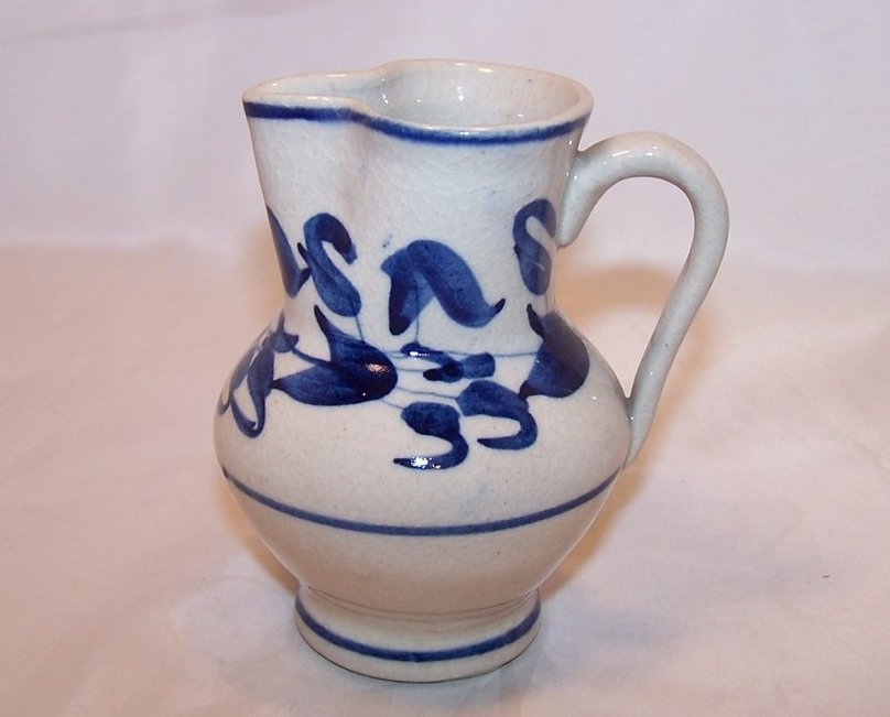 Image 0 of Hand Pinch Pottery Creamer, White, with Blue Flowers and Leaves