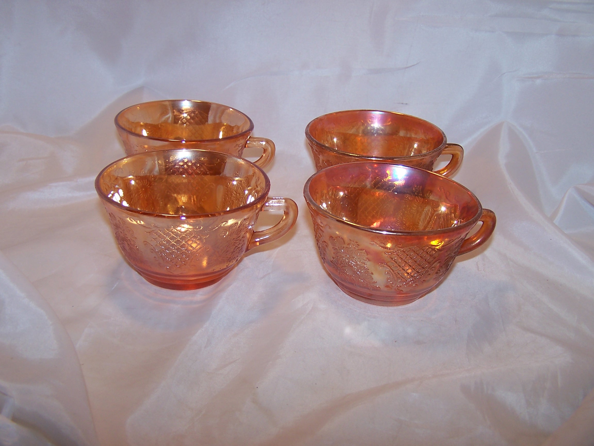 Marigold Carnival Glass Creamer and Cups, Flowers and Lattice Pattern