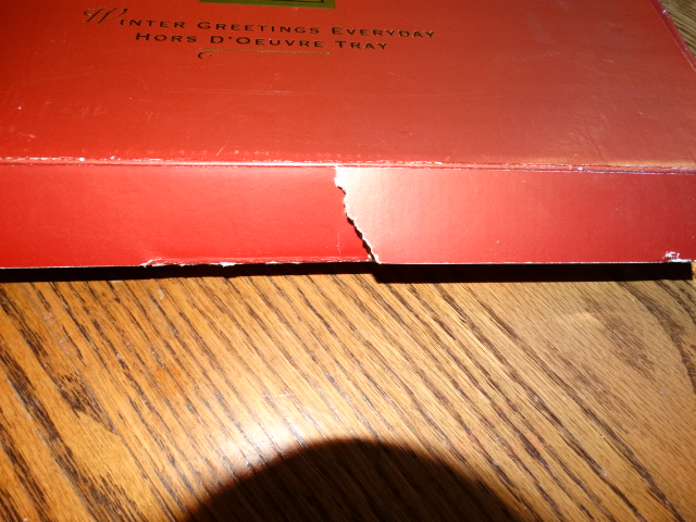 Front Flap of Box Has Tear