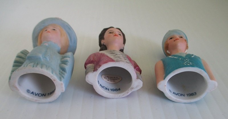 3 ladies from the Avon American Fashion Thimbles series. Each depicts a different era in time. 1890s to 1920s. 2 inches tall and marked Avon.