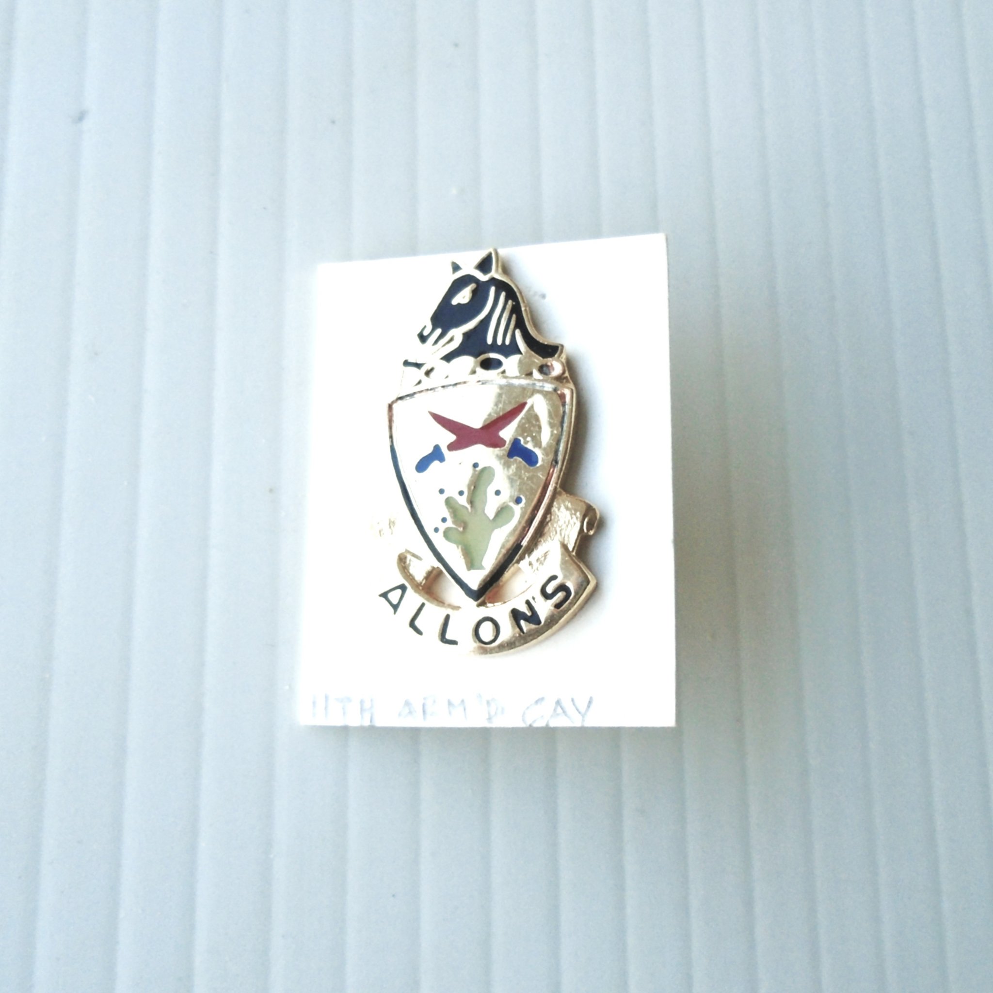 11th U.S. Army Armored Calvary DUI insignia metal pin. Has Allons logo. Possibly WWII or Vietnam time frame. Worn on Army Uniforms and caps. V-21