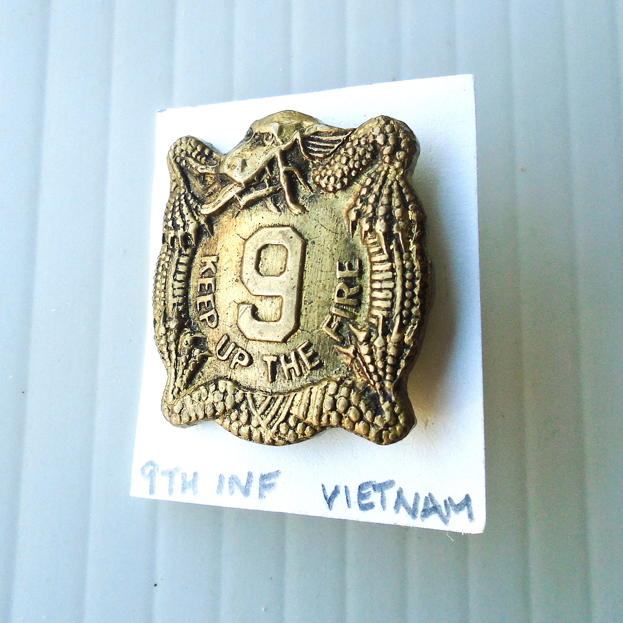 9th U.S. Army Infantry DUI DI insignia metal pin. Has the motto Keep Up The Fire. Stated to be Vietnam. Yon Se Co. Korea. Worn on Army Uniforms and caps