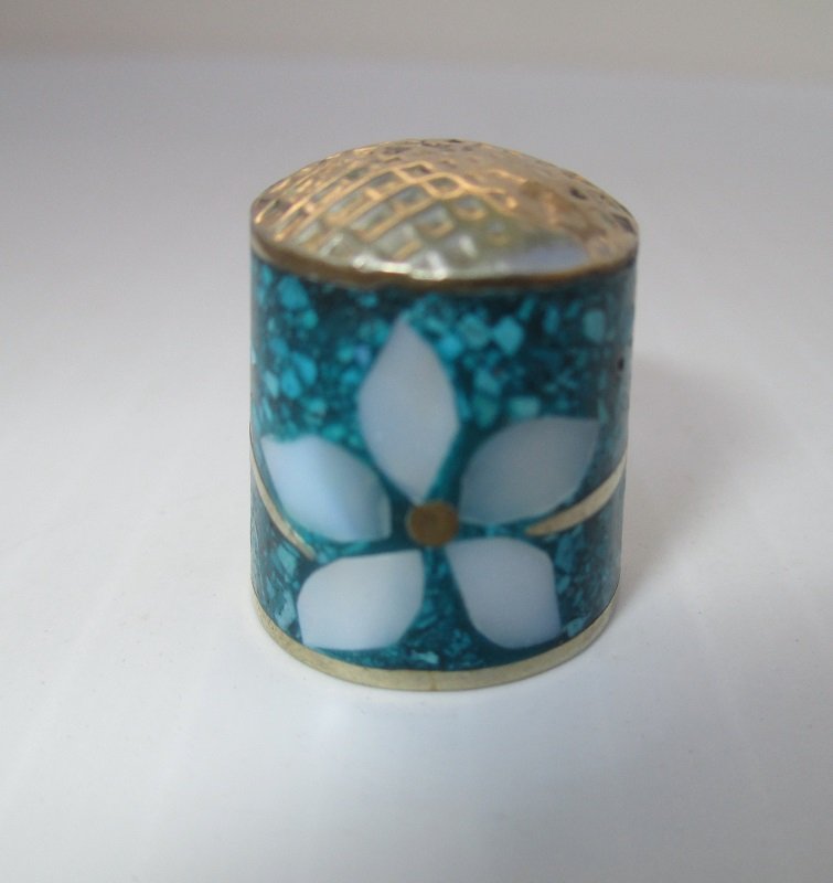 Decorative cloisonne enamel thimble marked Alpaca Mexico. Flower made of Mother of Pearl set into crushed turquoise. Circa 1970s. 