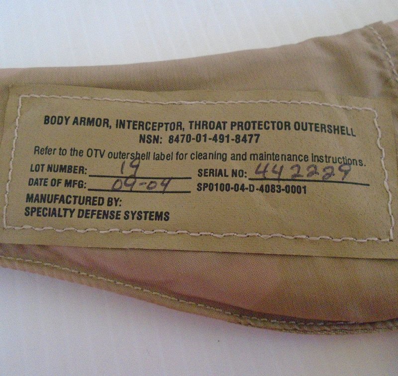 Military issue body armor. Throat protector with ballistic panel insert. 8470-01-491-8477 dated September 2004. Stated to be un-used.