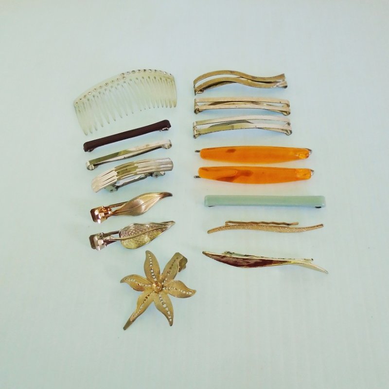 Estate sale collection of 15 hair clips and comb. Some marked Made in France, Goody, Lady Ellen. Estimated 1950s to 1960s.