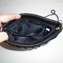 '.Black sequin evening bag.'