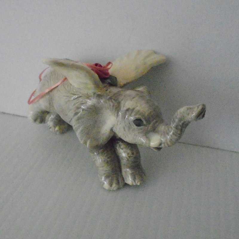 Hanging elephant angel. Can use as an ornament or for everyday display. Raised trunk. 5 by 3.5 inches. Gray and white. Estate find.