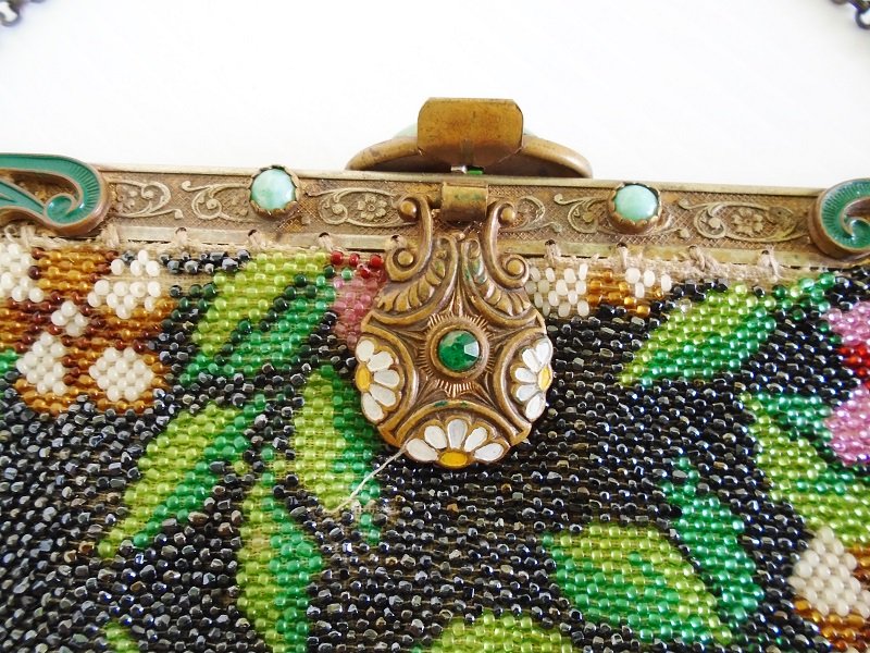 Clasp and decorative frame on circa 1910s Antique Floral Steel Beaded Purse. Roses, flowers, beads. Fringed. Most likely made in France.