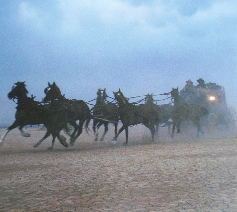 Wells Fargo Bank action poster featuring horses and stagecoach racing across the plains. 14 by 20 inch. Ready to frame.