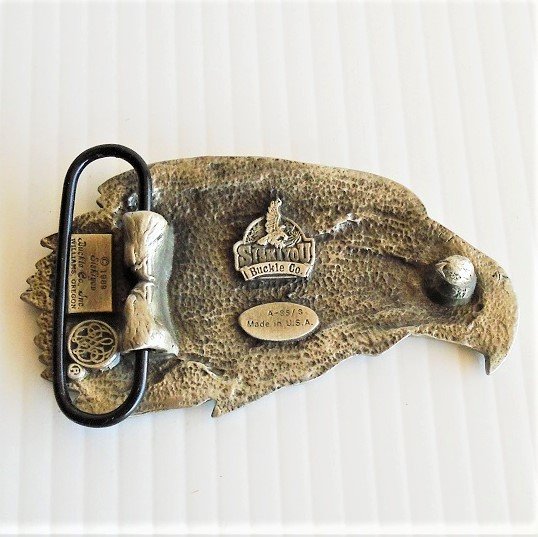Eagle’s head belt buckle from Siskiyou Buckle Company. Never used, still in original store display packaging. Dated 1989. 