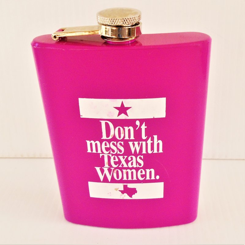 Bright pink hip flask that says ‘Don’t Mess With Texas Women’. 8 oz capacity, stainless steel. Stated to be unused.