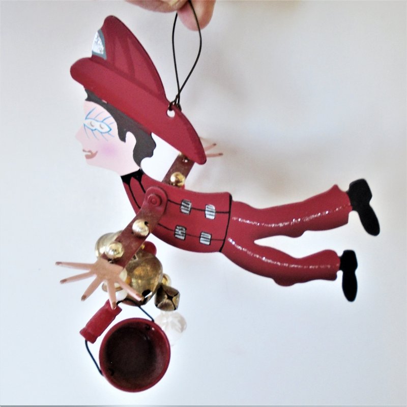 Karen Rossi Silvestri whimsical Christmas Fireman ornament. Can also be used year round as a mobile.