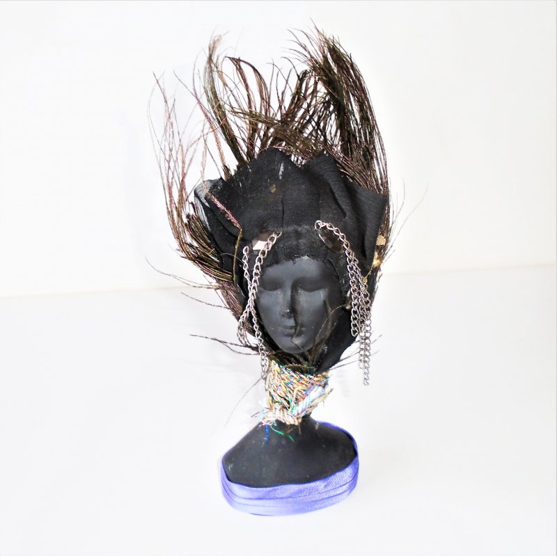 Bust of African American Black Lady with feathers on her head.