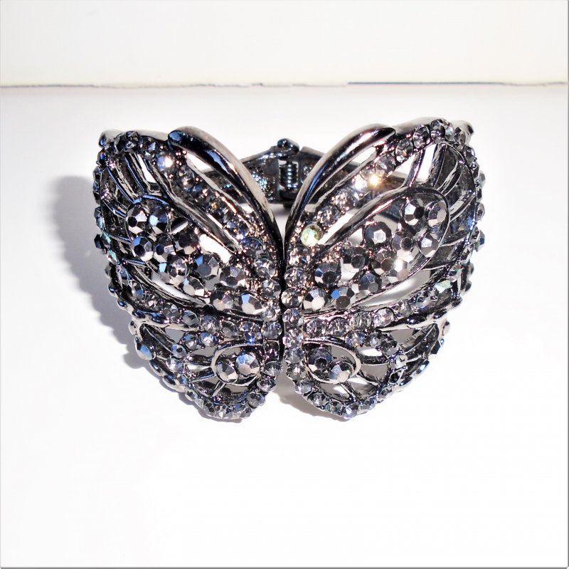 Butterfly clamper bracelet. Black rhinestones on black metal. Estate purchase.